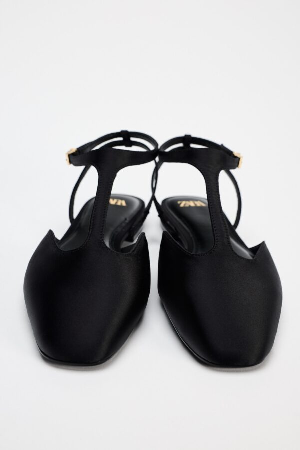 Black Charm T-Strap Flat Shoe