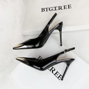 Noir Luxe gold tip slingback