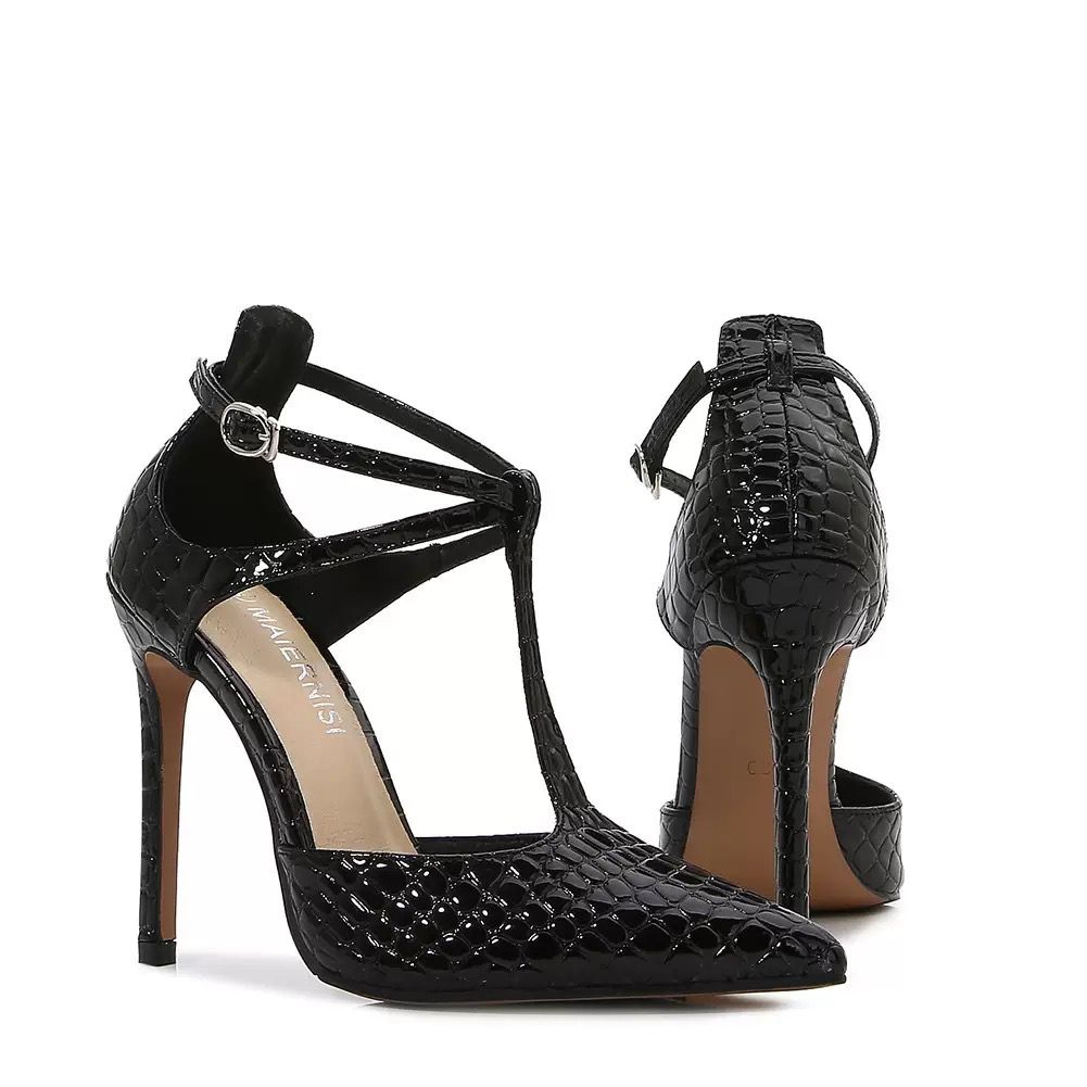 The High Black Ankle Strap is a timeless classic that combines elegance and confidence. Featuring a sleek black finish, secure ankle strap, and refined high heel.