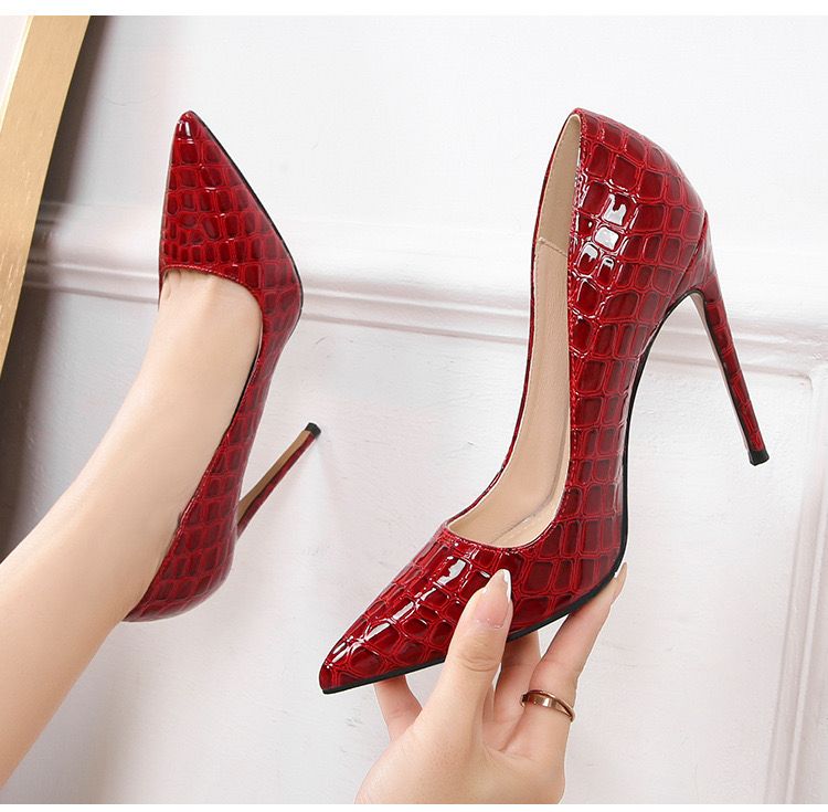 The High Red Cover Shoe makes a bold and elegant statement with its striking red finish and refined full coverage design.