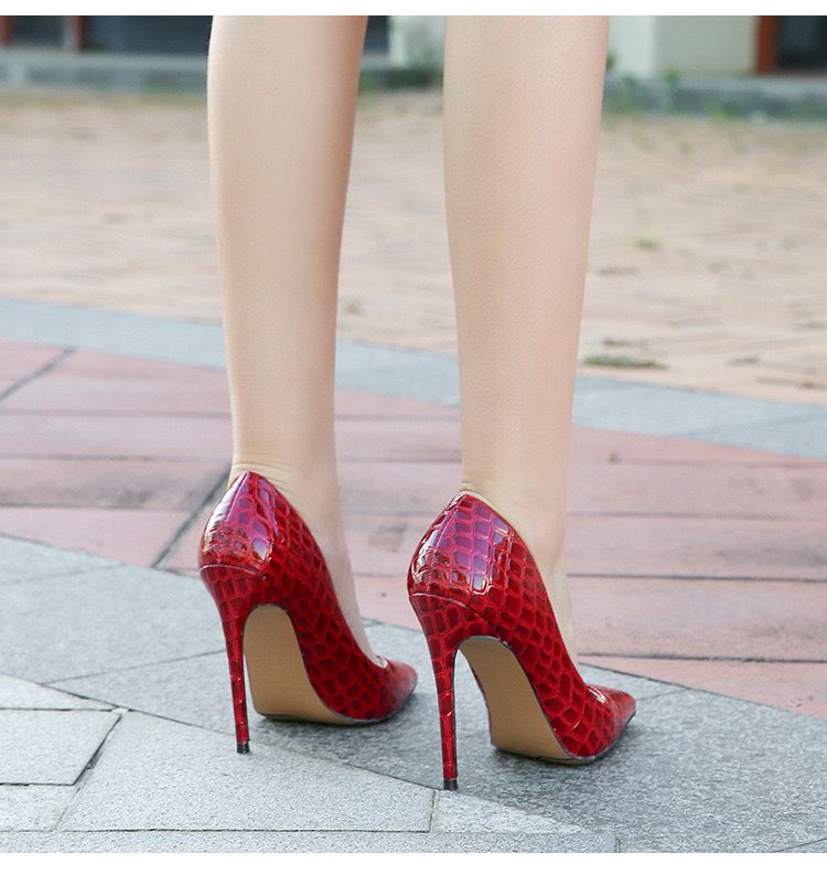 The High Red Cover Shoe makes a bold and elegant statement with its striking red finish and refined full coverage design.